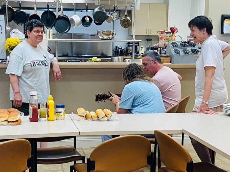 Learning guitar and fellowship during mission trip