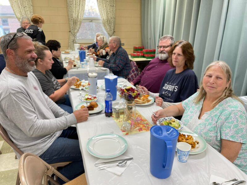Sharing in a meal together in our Fellowship Hall