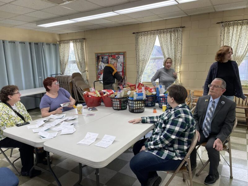 Putting together Thanksgiving Baskets for community members