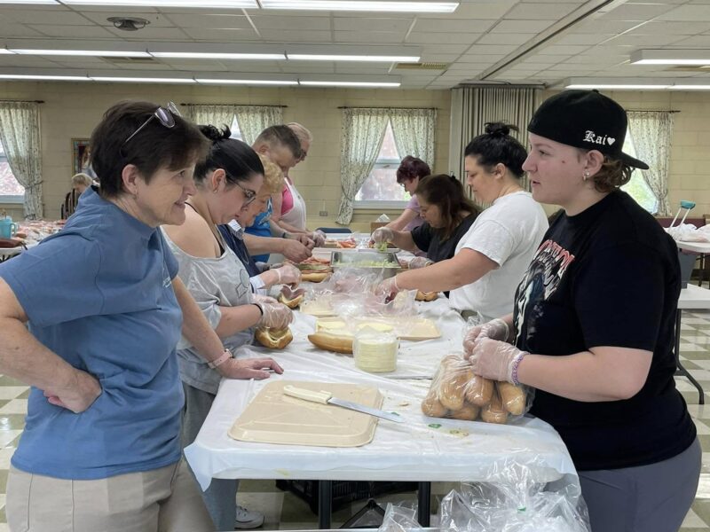 Our Mission and Culinary Team making Hoagies